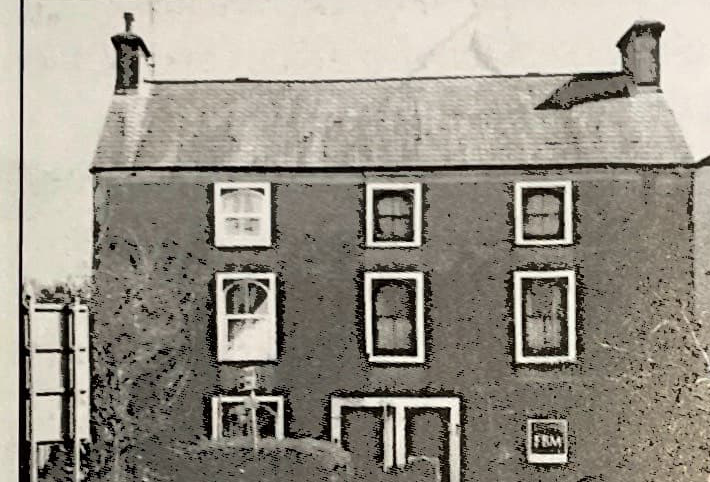 Historic image of the White Hart divided into two properties